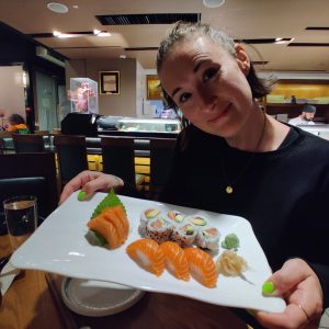 Jessie Roe holding sushi platter
